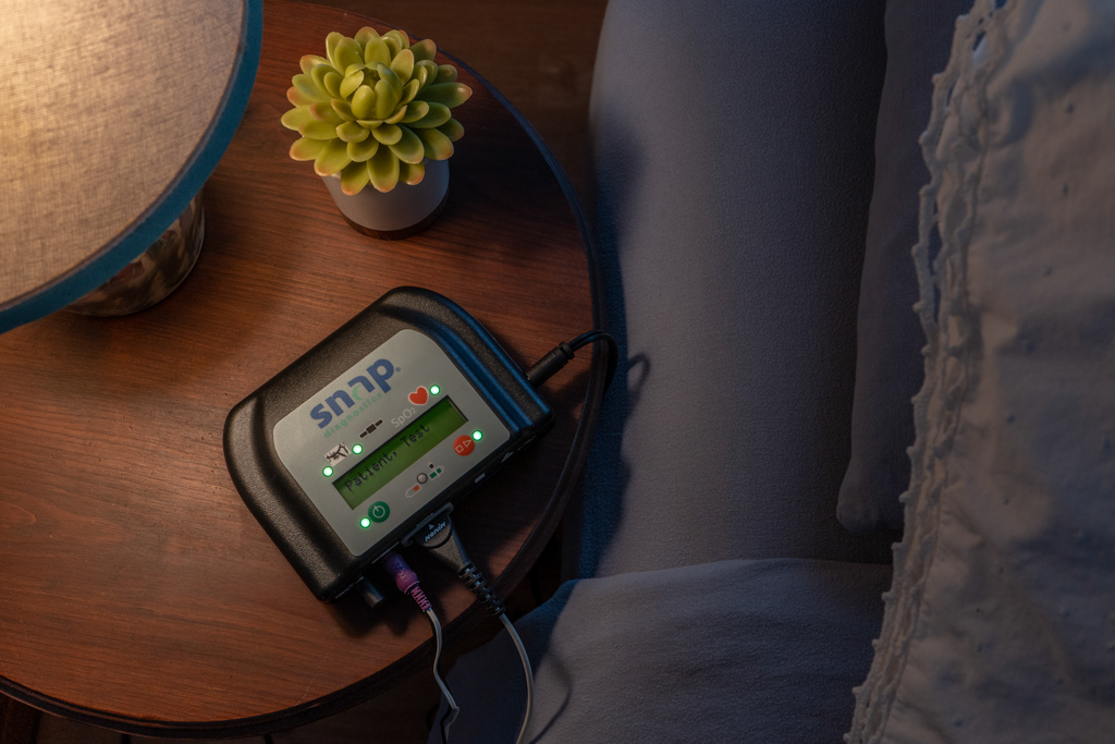 Snap Diagnostics home sleep test — patient resting comfortably at home